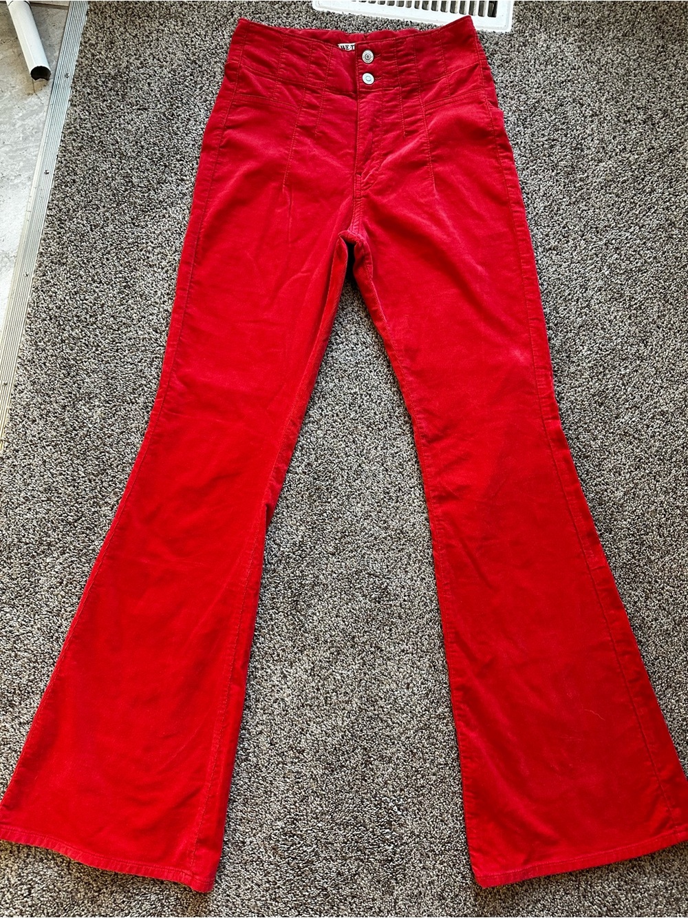 We the Free High Rise Corduroy Flare Pants in Rust Red
